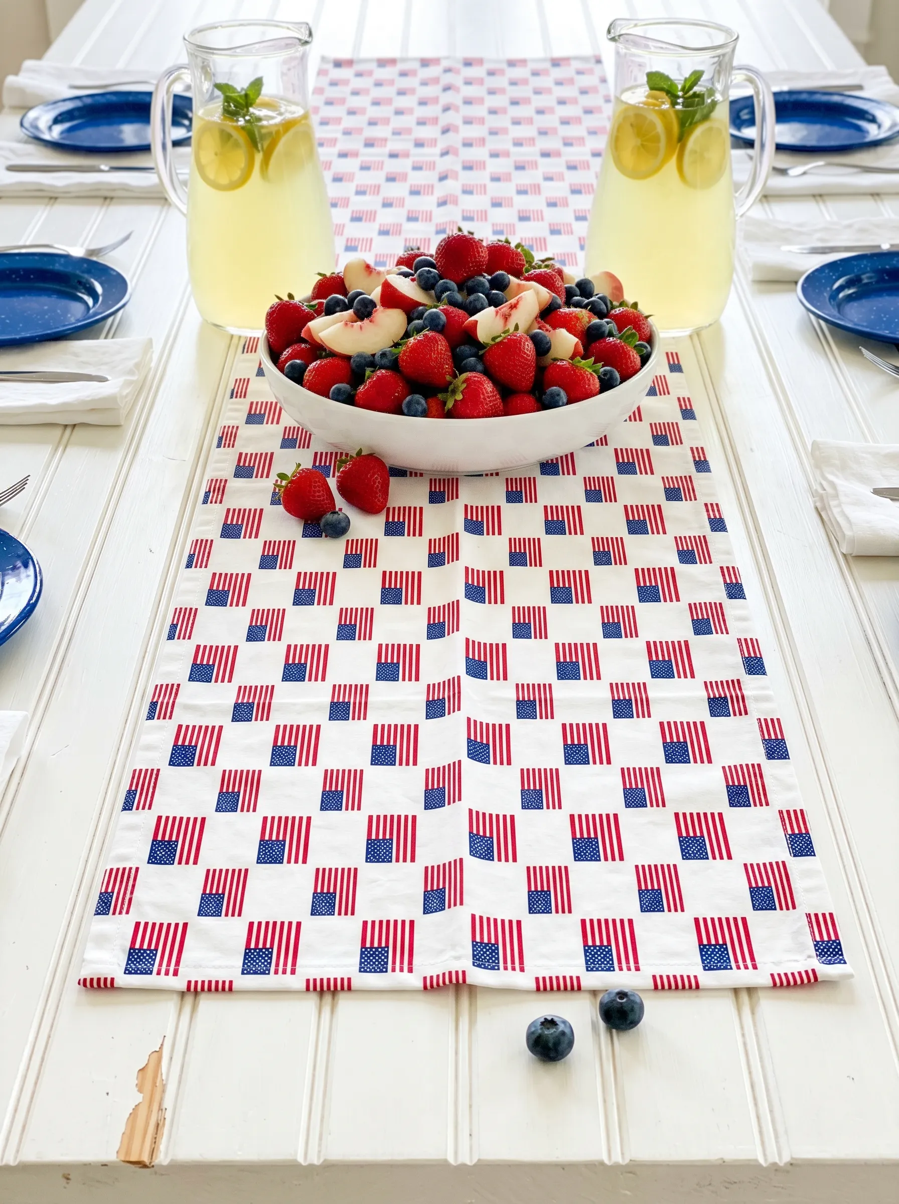 The Small Flag-Print Table Runner With Enamelware Setting
