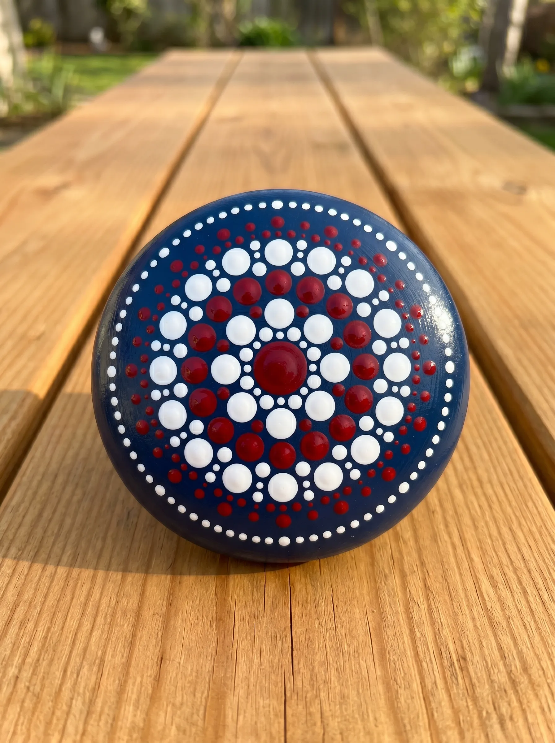 The Navy Mandala Dot Rock With Concentric Red and White Rings